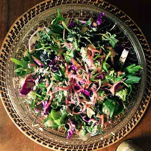 Big bowl of greens with shredded vegetables