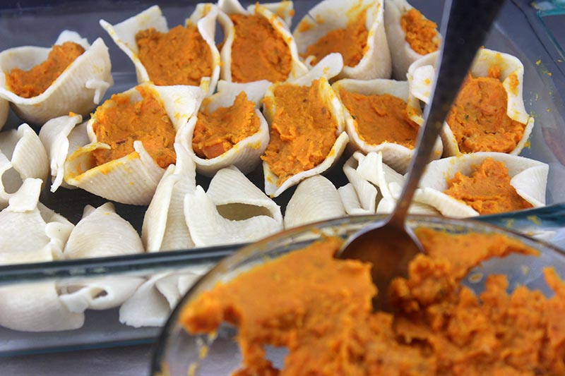 Stuffing the shells with mashed sweet potato