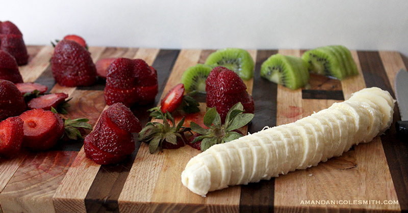 Sliced strawberries, kiwis, and bananas